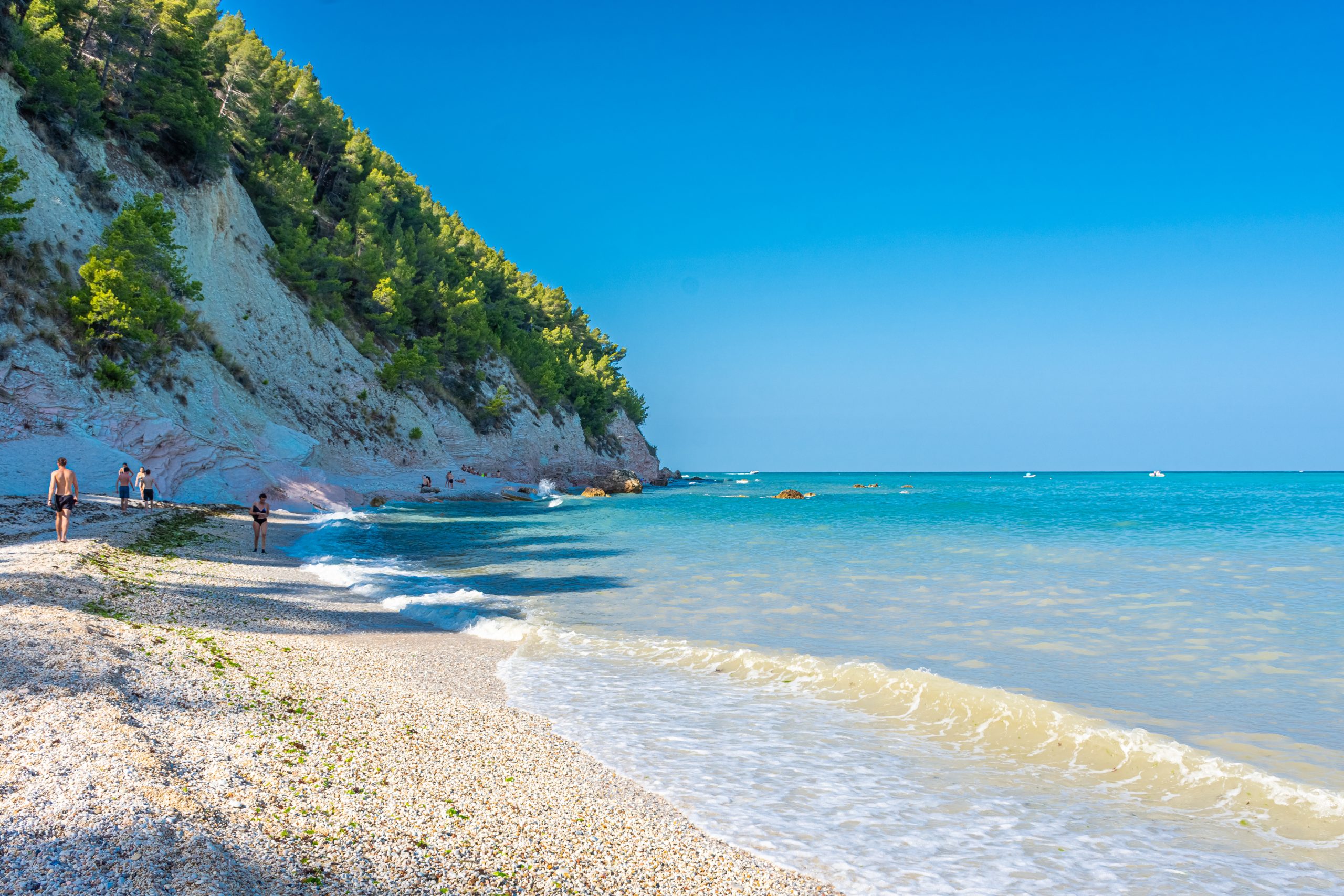 SIROLO, ITALY, 23 JULY 2021: The beautiful Sassi Neri Beach down the Conero Mount in the Marche Region